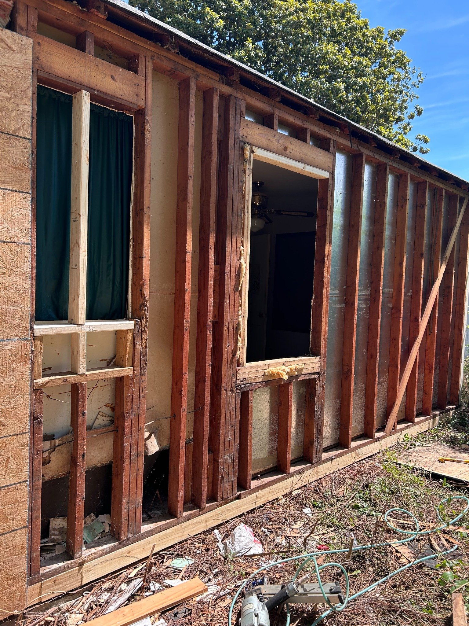 Before — structural framing and demolition stage