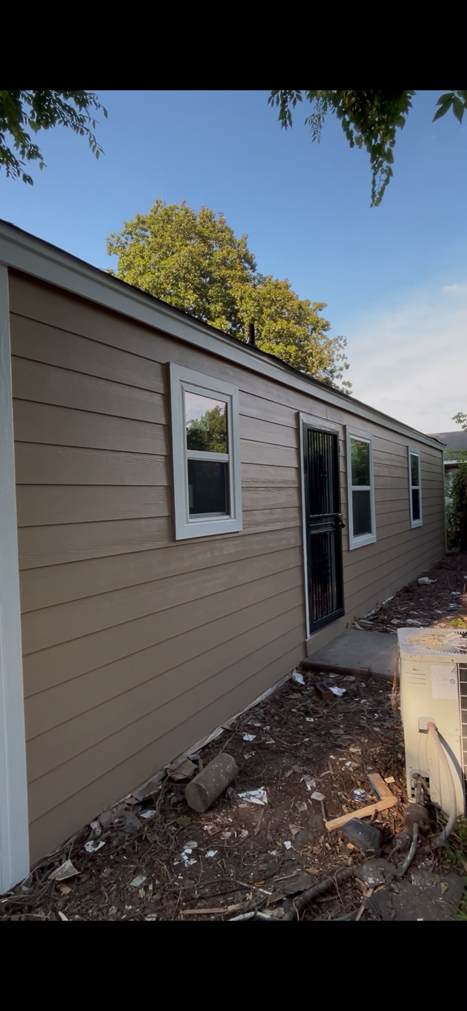 After — completed exterior siding and trim