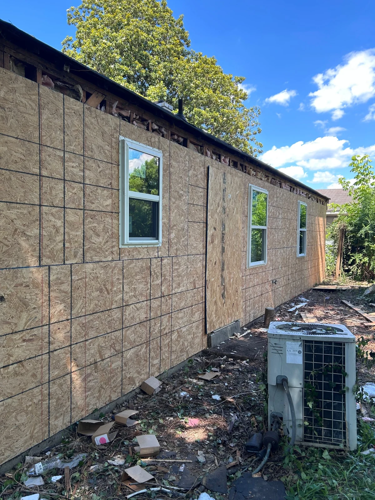 New exterior sheathing and windows during installation